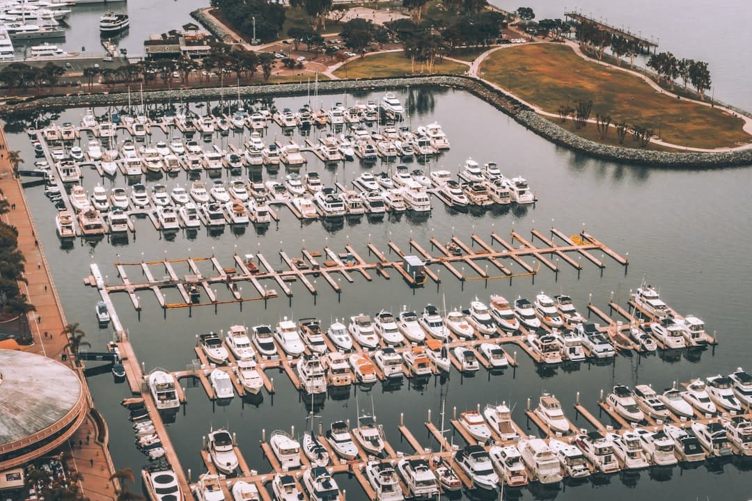 rows of white sportfishing boats stacked into a Pompano marina, all of them eventually need a saturday morning call