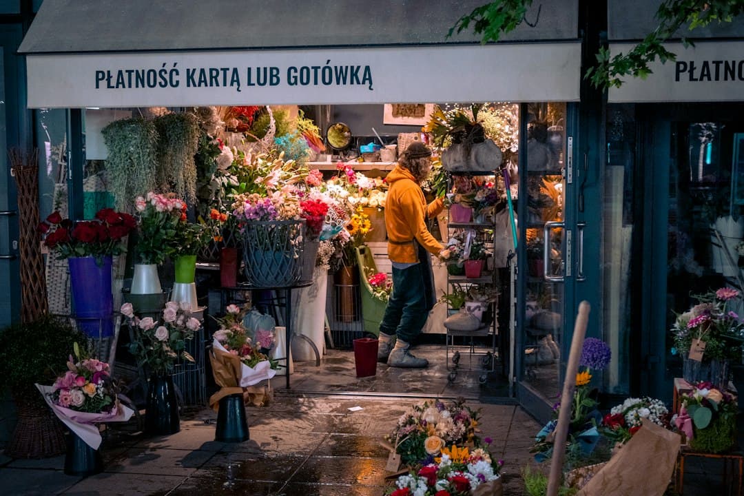 Closed small business storefront on a rainy Seattle street after hours