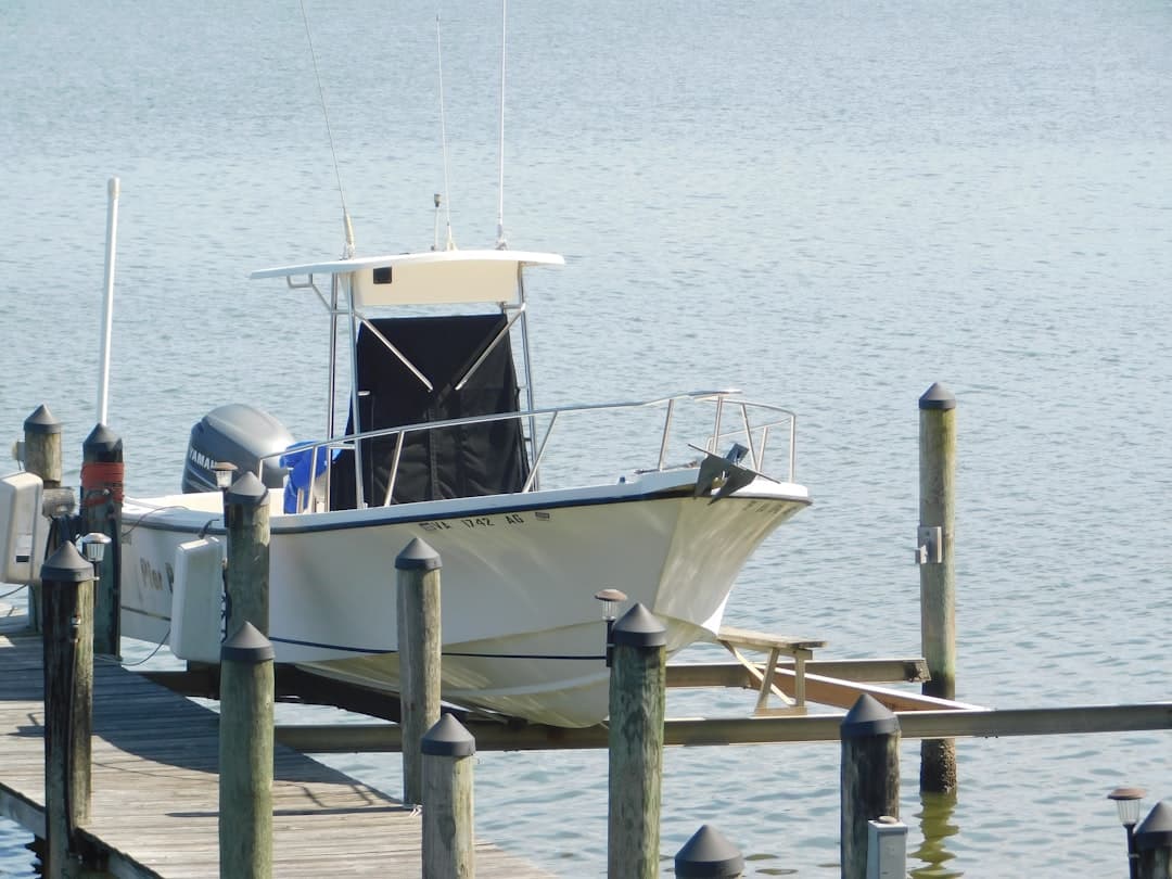 white sportfishing boat tied to the dock, somebody actually picked up the phone