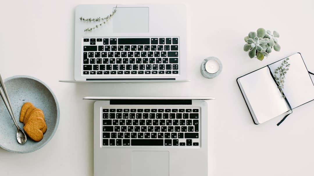 Freelancer working at a cafe table with laptop, juggling three client lead generation accounts before lunch
