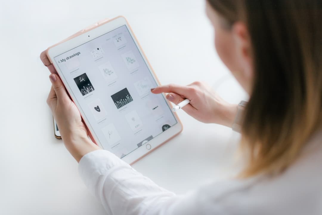 Real estate agent at desk with tablet, finally pre-qualified buyer on the line