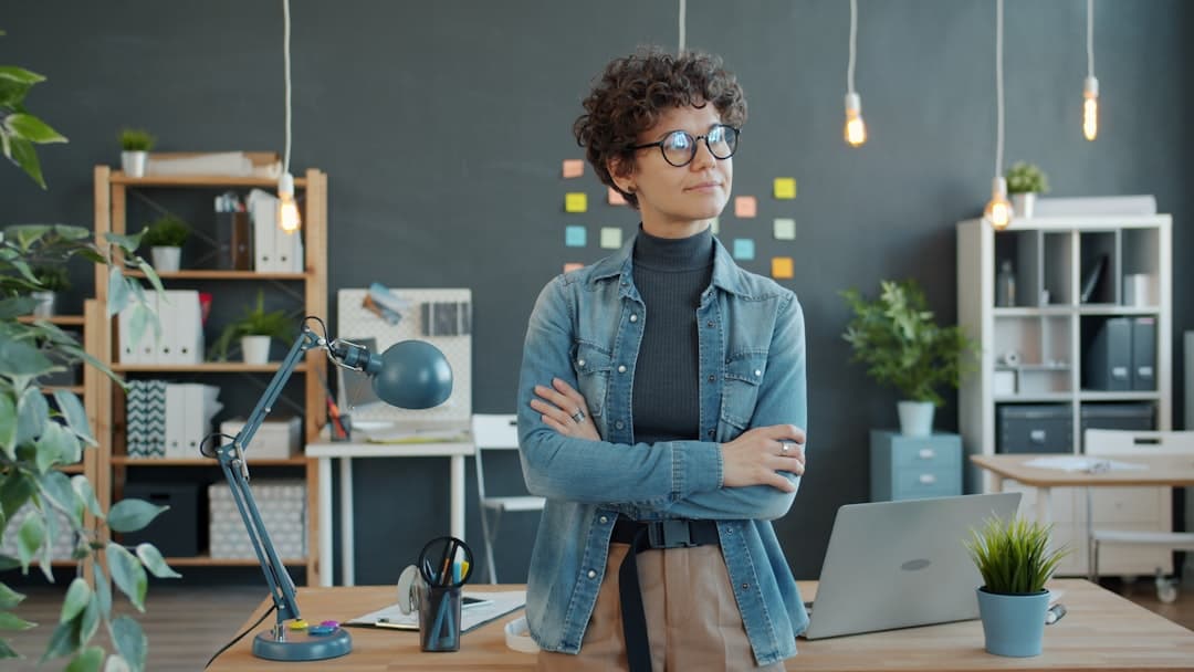 Confident small business owner with arms crossed, the kind of calm you get when AI for small business runs the lead and follow-up layer in the background and the owner can focus on actual operations