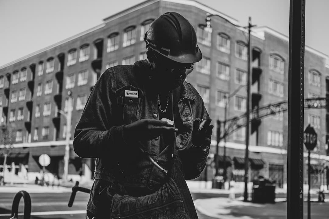 Contractor checking smartphone in work truck while lead follow-up automation answers a new inquiry