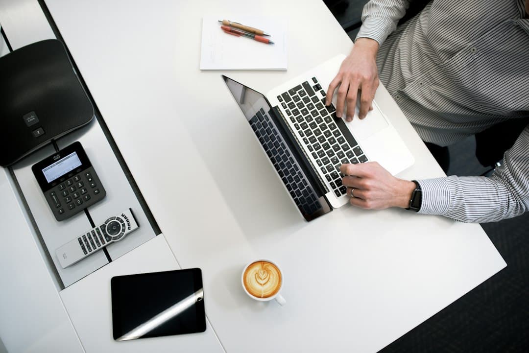 Office manager reviewing a CRM integration pipeline on a monitor while quote follow-up sends automatically
