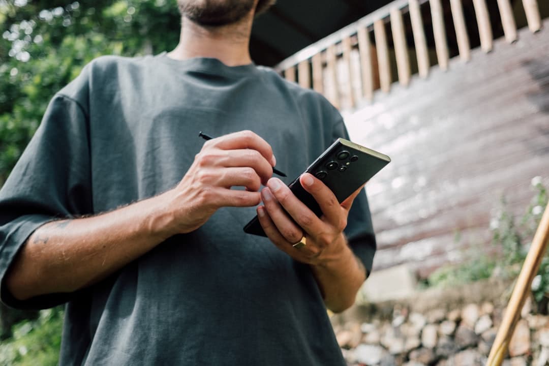 Homeowner reviewing a landscaping lead generation quote on their phone after receiving an automated follow-up text about spring services